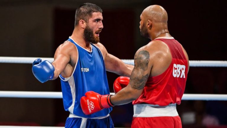 French boxer Mourad Aliev refuses to leave ring canvas in ...